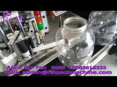 大型丸ボトル用自動粘着ラベル貼付機